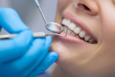 Dentist Checking Patient Teeth