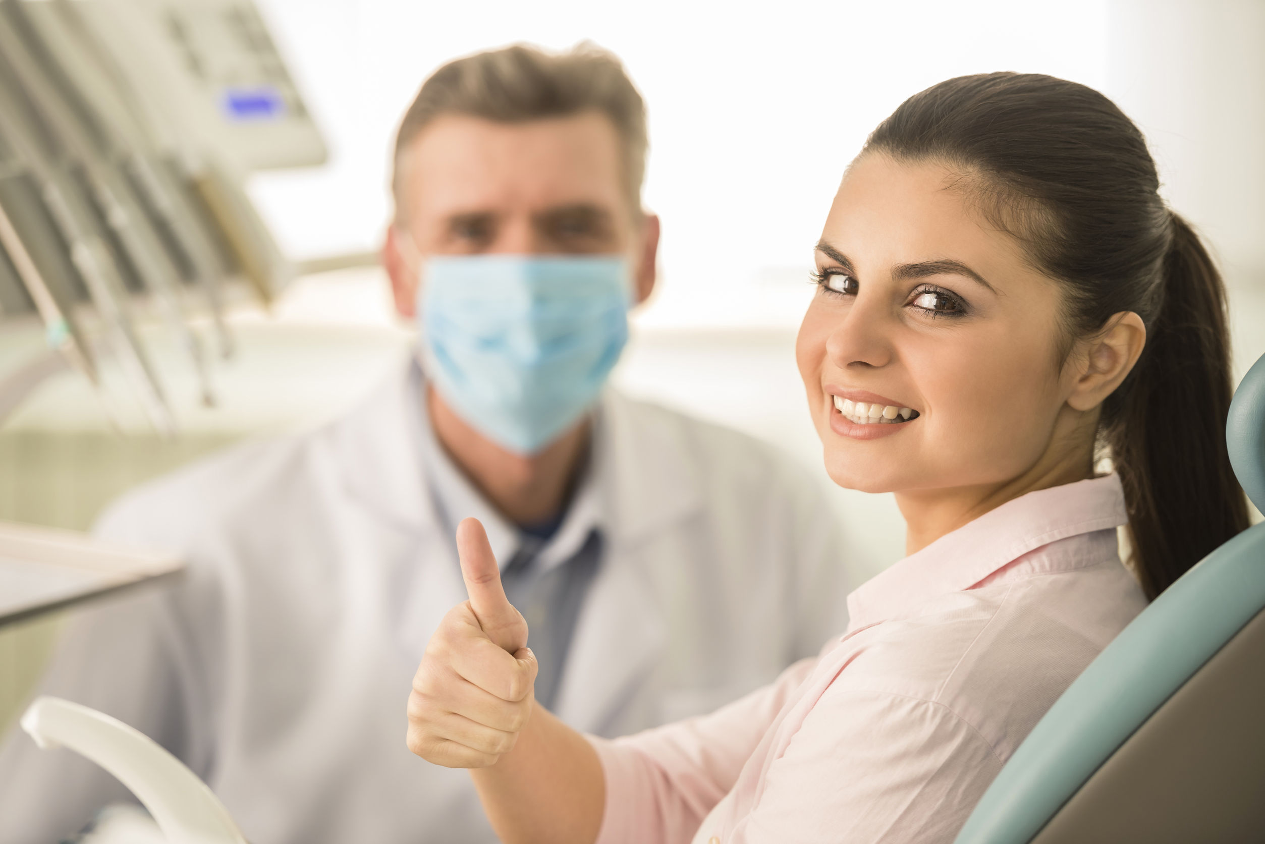 Female Patient Smiling in Dental Office